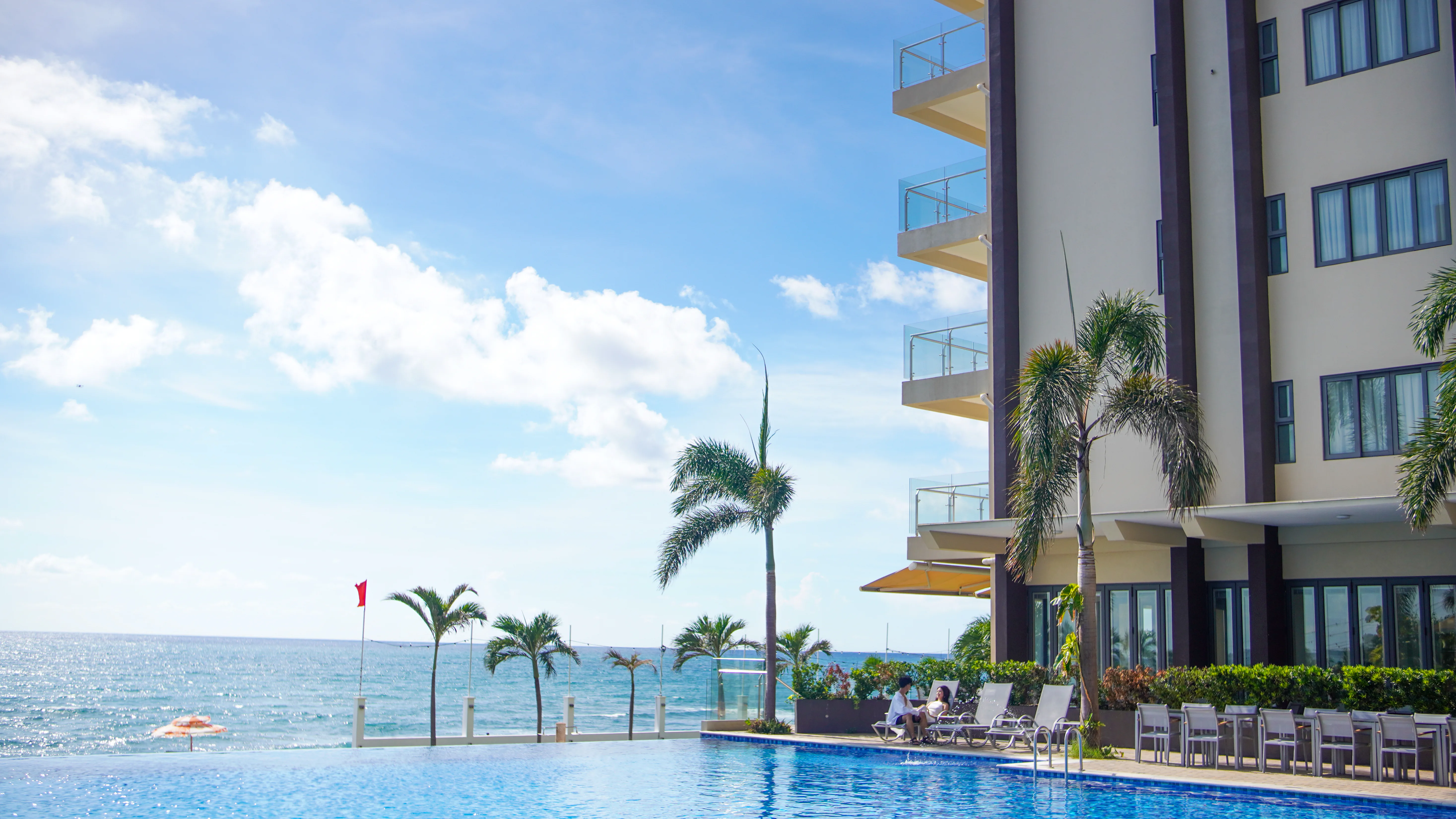 Luxury hotel courtyard with pool and balconies