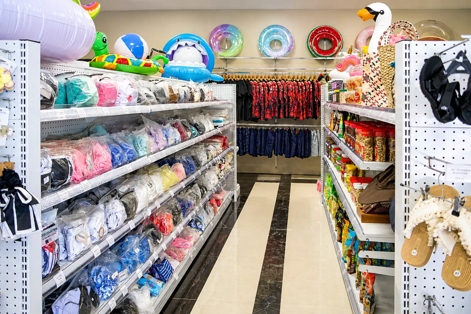 Guest shopping for a pool float in the Boutique Shop
