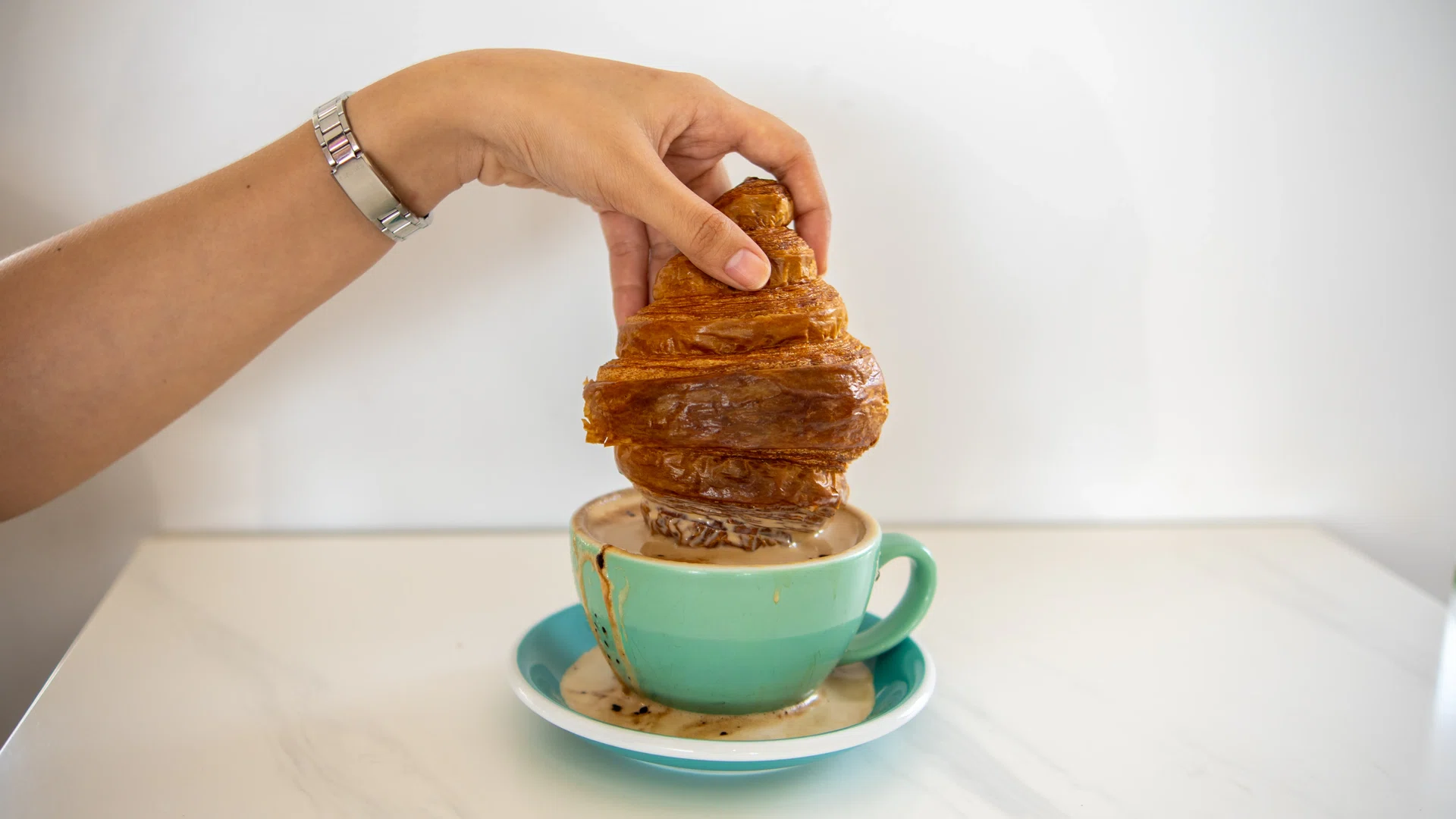 Croissant Stack Over Coffee Cup